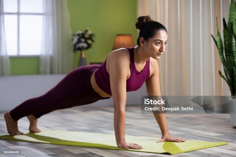 young woman doing yoga at home